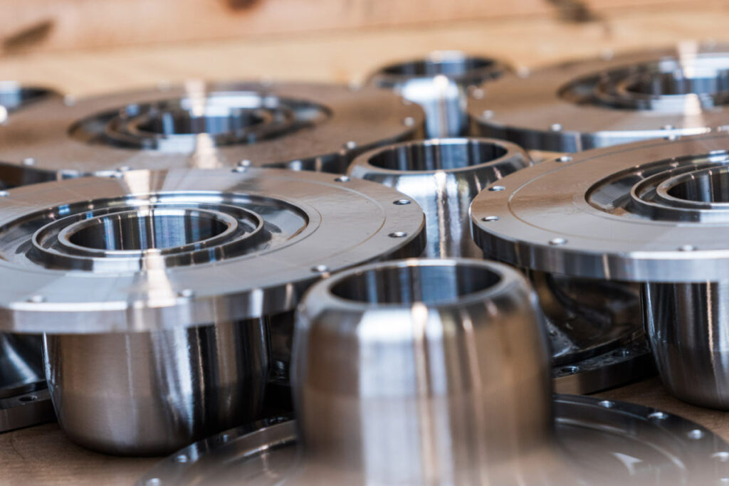 Precision-machined metal parts produced using CNC machining on a workbench.