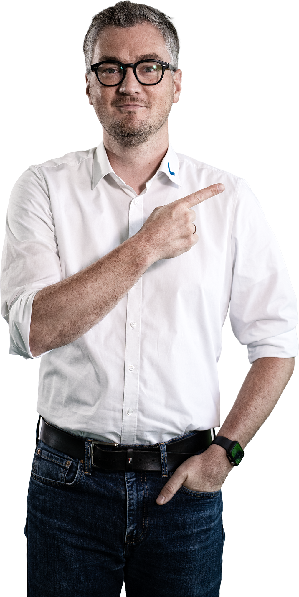 A man in a white shirt and jeans is pointing to the side.