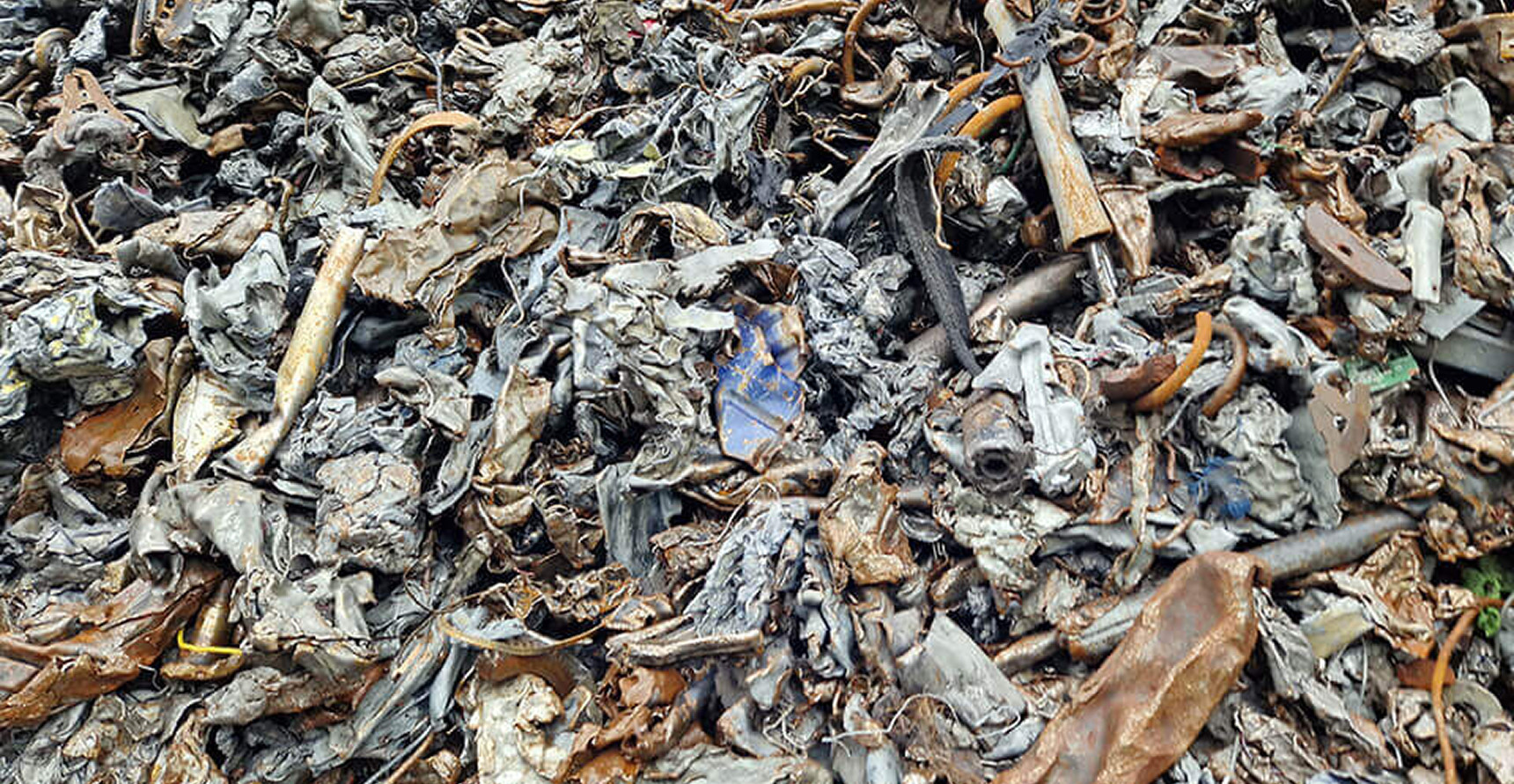 Piles of scrap metal, including electrical coils known as "meatballs."