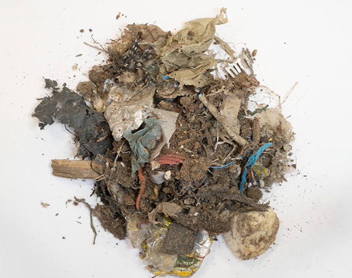 Pile of lightweight shredded material containing various materials
