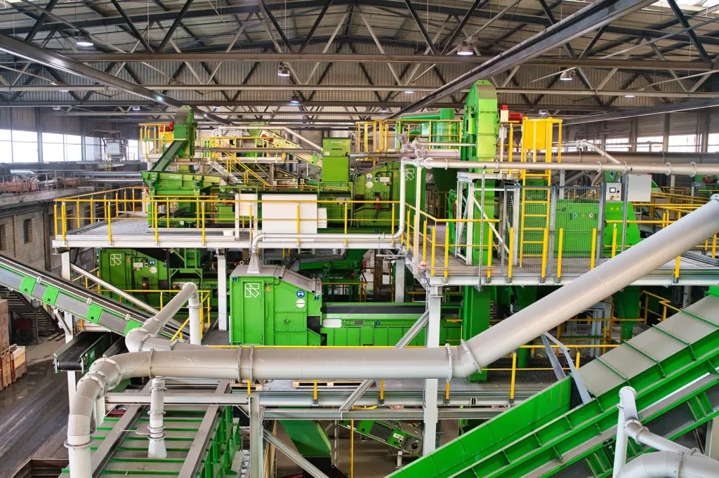 e-waste recycling plant featuring SPALECK screening machines and conveyor chutes, as well as TOMRA sorting technology for WEEE