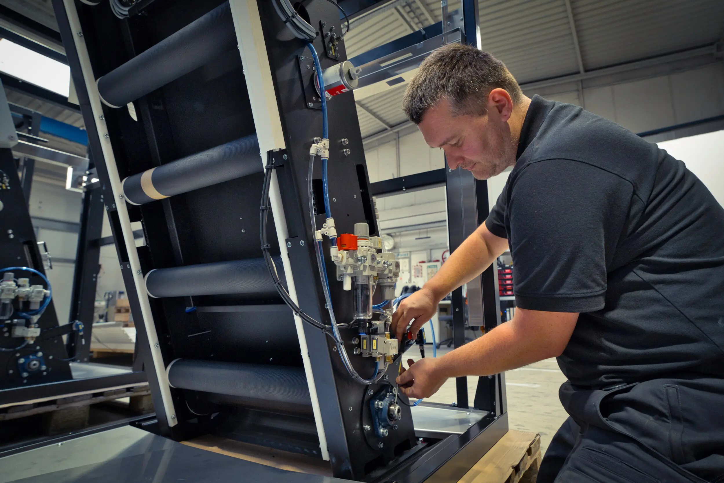 A SPALECK employee is assembling a component