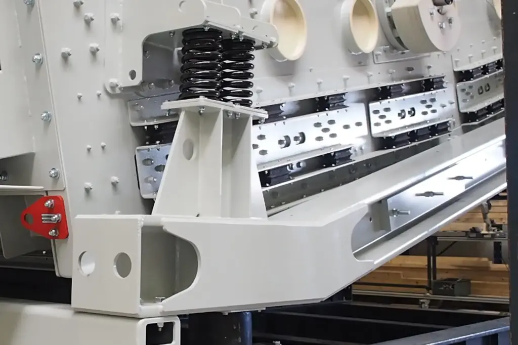 Industrial machine with visible components and springs.