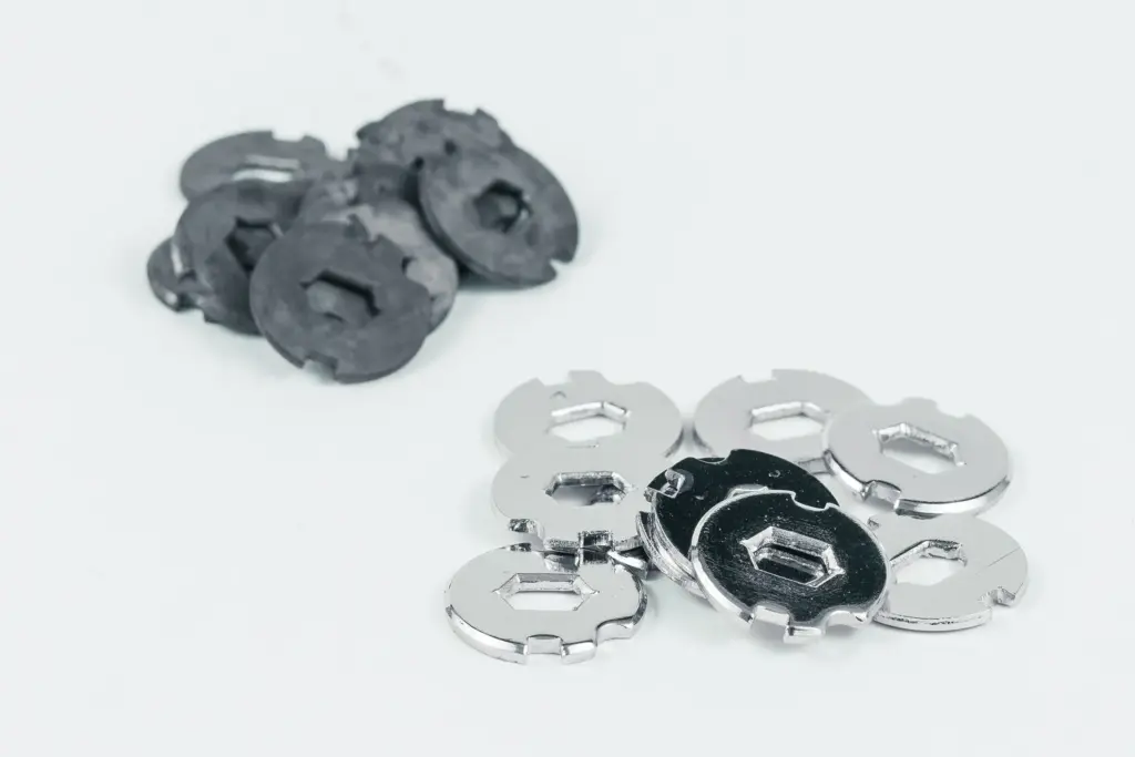 Metal parts before and after vibratory finishing; the one on the left is unfinished, the one on the right is polished.