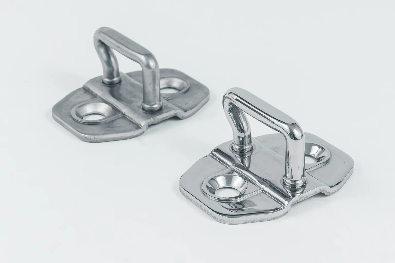 Two metal workpieces with polished surfaces.