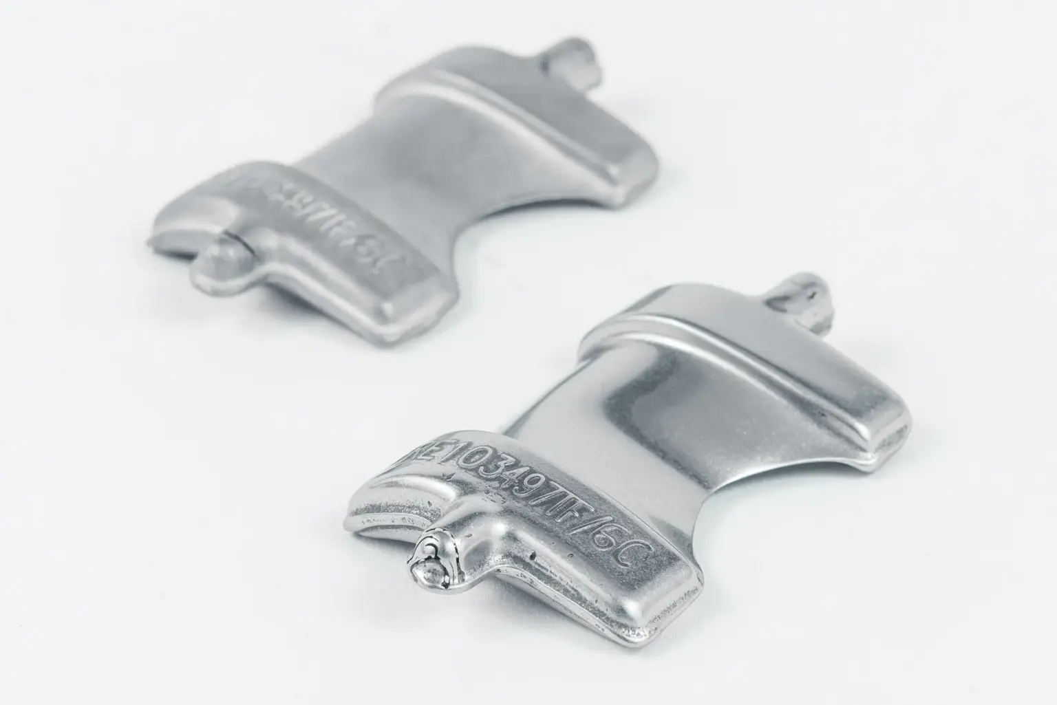 Two metal components with smooth surfaces; an example of surface finishing.