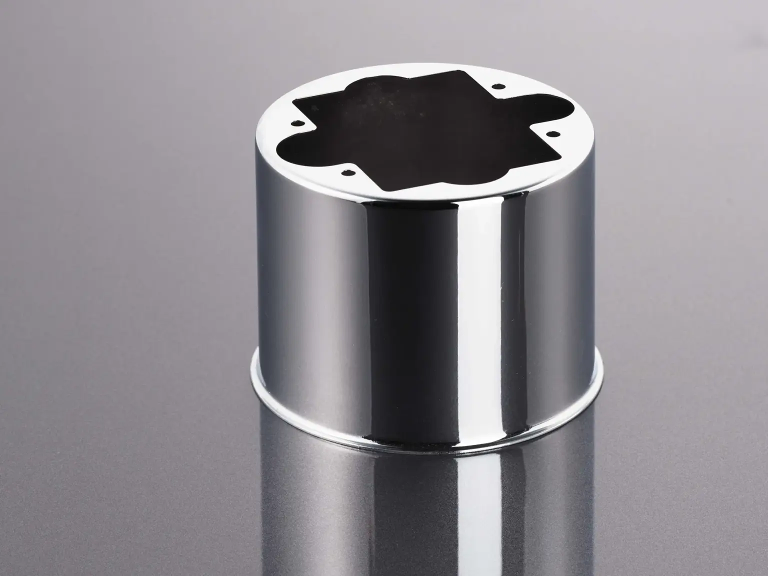 A metal cylinder with a shiny surface as an example of surface finishing.