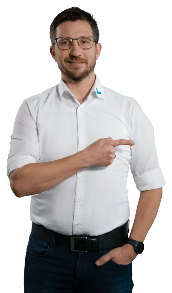 A man in a white shirt is pointing to the side.