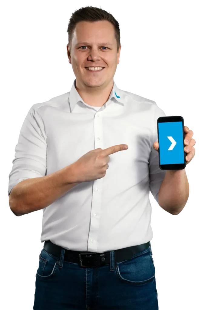 A man in a white shirt is pointing at a smartphone with a blue screen.
