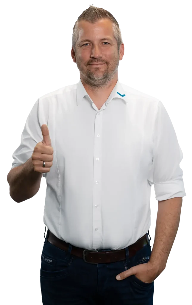 A man in a white shirt gives a thumbs-up.