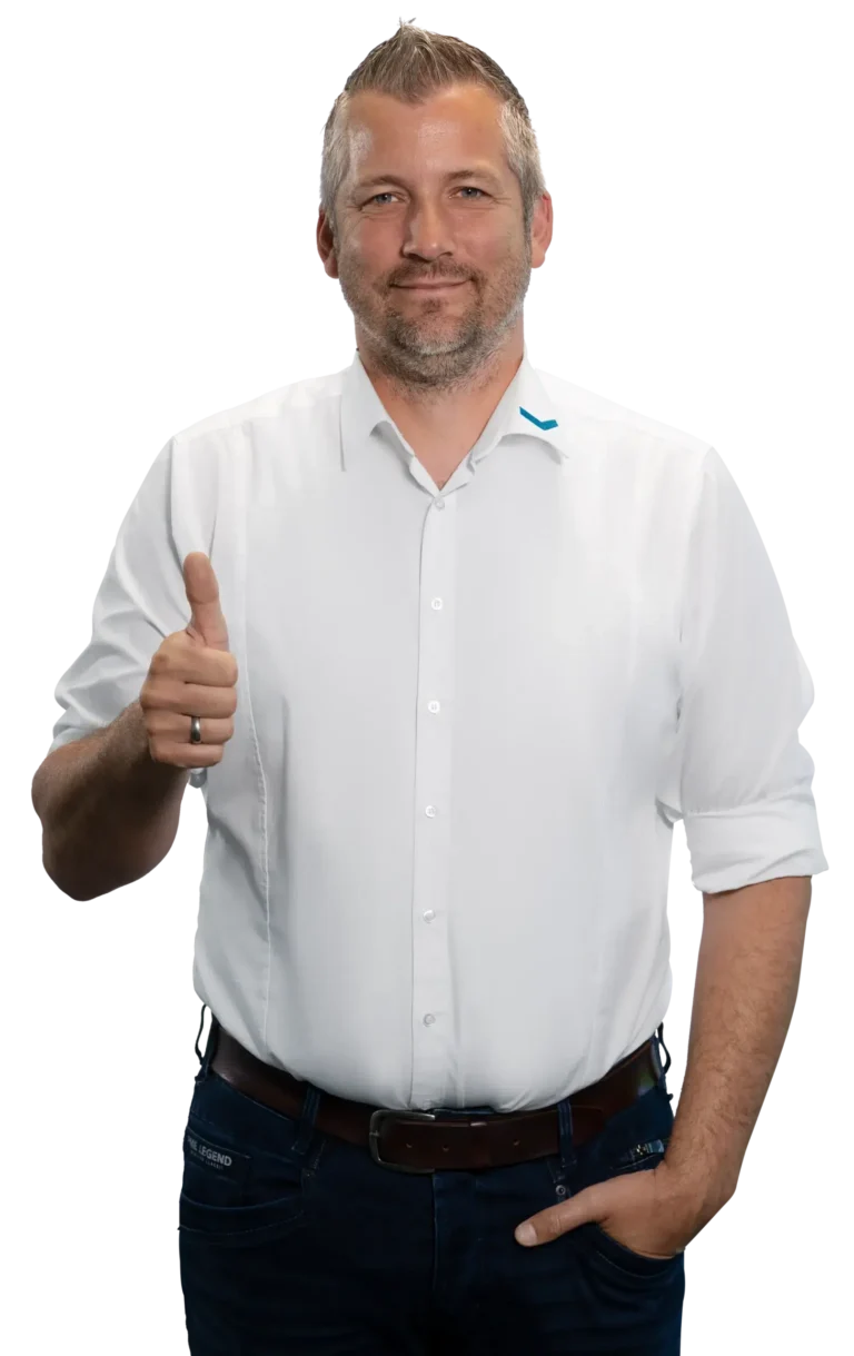 A man in a white shirt gives a thumbs-up.