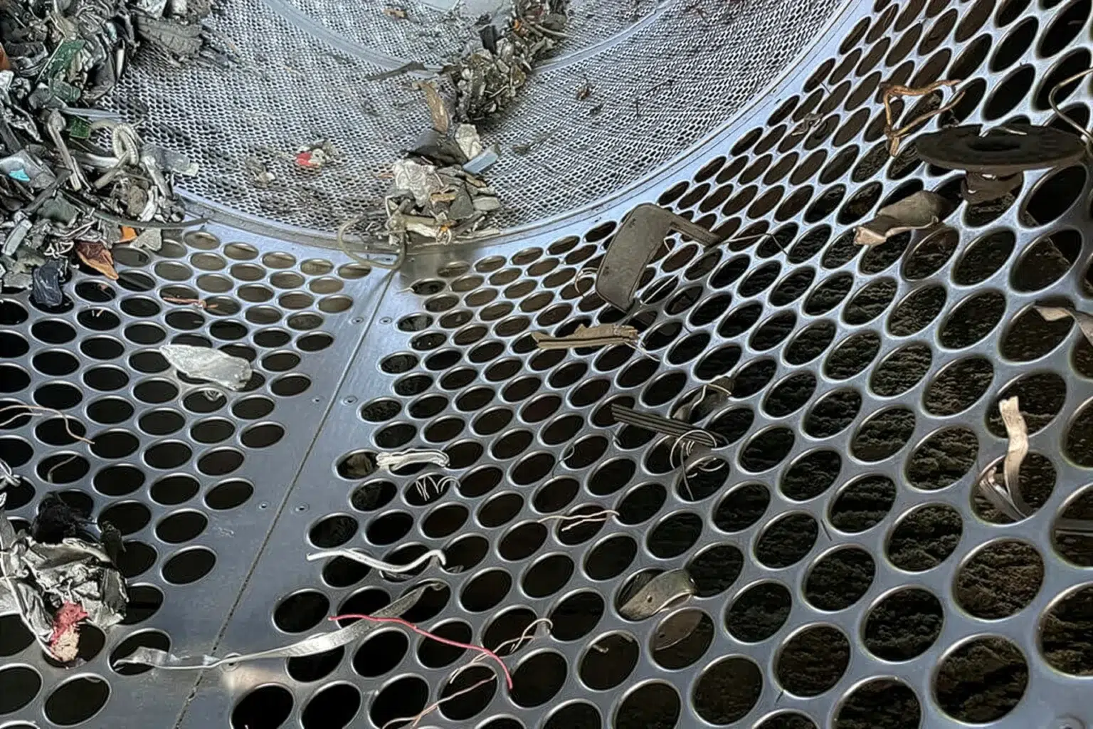 Interior view of a drum screen containing metal scrap.