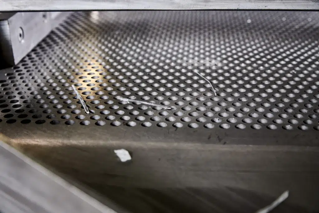 A close-up view of an over-length separator in plastics production